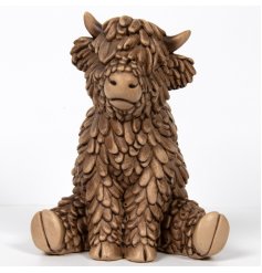 Add the charming Hughie Highland Cow ornament to your collection for a cozy touch of Scottish style. 