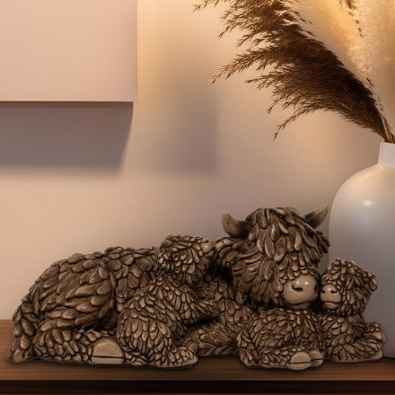 Meet Hughie and his adorable babies, the perfect addition to any highland cow fan's home decor