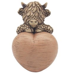 Fall in love with Hughie Highland Cow W/heart, the cutest addition to your home decor