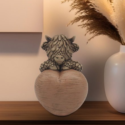 Fall in love with Hughie Highland Cow W/heart, the cutest addition to your home decor