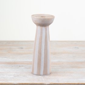 Stylish ceramic candle holder featuring natural hues and delicate striped accents.