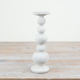 Elegant tall candle holders with a charming design for stylish home decor.