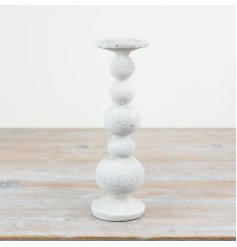 Elegant tall candle holder with a charming design, perfect for adding height and style to any space.