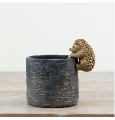 Bring charm and whimsy to any space with this durable, stylish planter.