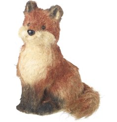 Proud sitting fox in a mix of brown & cream tones.