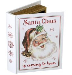 A gorgeous decorative book featuring a Santa head and the words 'Santa Claus is coming to town' . 