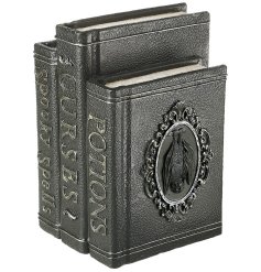 A creepy trio of 3 Halloween spell books fused together to create a ghoulish masterpiece for Halloween.