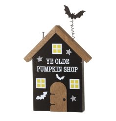A striking black decorated wooden house, perfect for Halloween. 
