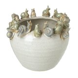 A chic planter in a neutral colour tone with an array of snails around the rim.