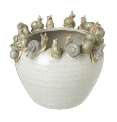 A chic planter in a neutral colour tone with an array of snails around the rim.