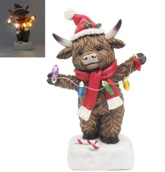 Add a touch of Scottish charm to your holiday decor with our Highland Cow Boy With Led Lights