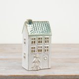Light up your home with this charming green porcelain LED house