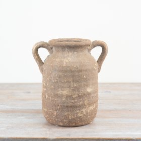 Elevate your space with our Ceramic Vase featuring a rustic and elegant design.