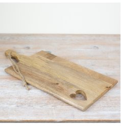 Revamp your culinary skills with our stylish and sturdy wooden cutting board. 