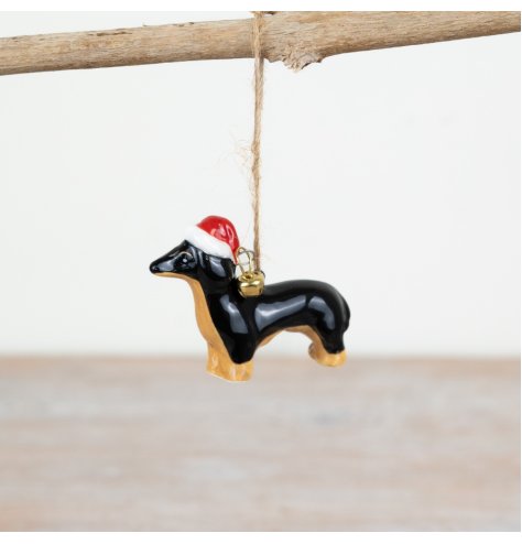 Bring holiday cheer to your home with our Sausage Dog Jute Hanger