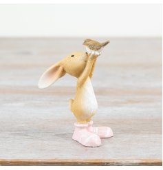 Add a touch of charm to your home with our delightful decoration showcasing a rabbit and bird in brown.
