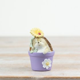 Add charm to your windowsill with this playful plant pot and hedgehog decor piece.