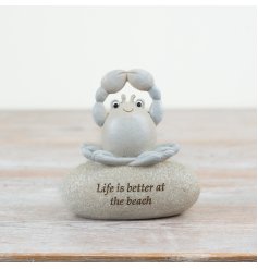 Life is better at the beach. A charming slogan pebble featuring a cute yoga crab decoration. 