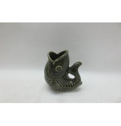 Add a pop of green to your décor with our sleek fish-inspired vase!