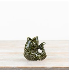 Add a pop of green to your décor with our sleek fish-inspired vase!