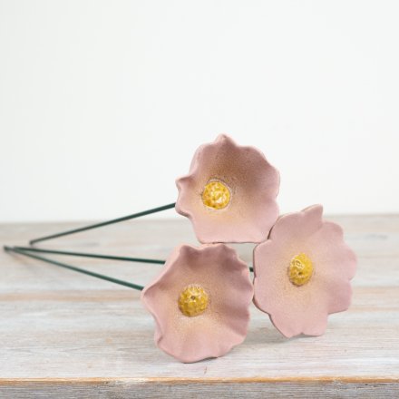 Enhance your garden or patio with an eye-catching flower stake that adds a vibrant touch of color.