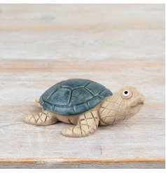 Add a touch of the ocean to your home with our stunning Sea Turtle Ornament.