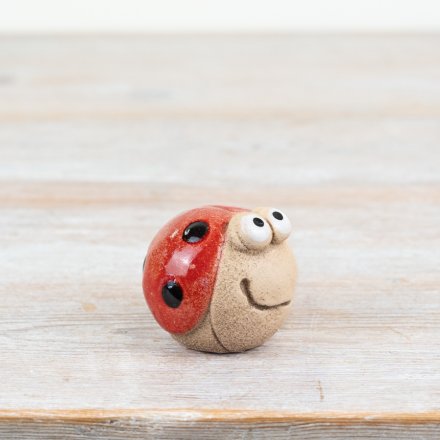 Invite irresistible charm into your home with this delightful Ladybug Iron Ornament.