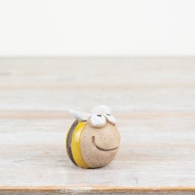 Adorable yellow decoration adds charm to any space.