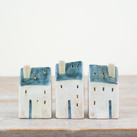 Discover the delightful coastal vibes of our Village Cottage, featuring LED lights and rustic accents.