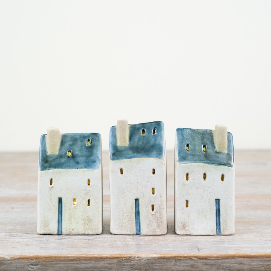 Discover the delightful coastal vibes of our Village Cottage, featuring LED lights and rustic accents.