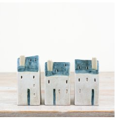 Elevate your home decor with a touch of rustic charm from the Village Cottage Windlight.