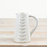 A stylish jug with a decorative leaf design pattern. Complete with a natural glaze.