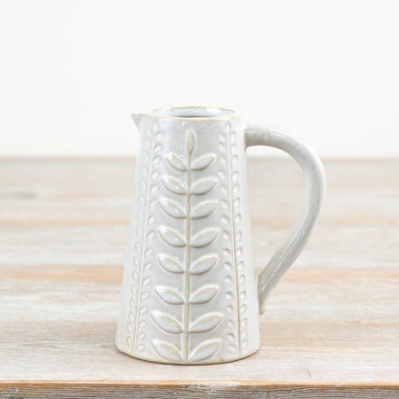 A stylish jug with a decorative leaf design pattern. Complete with a natural glaze.