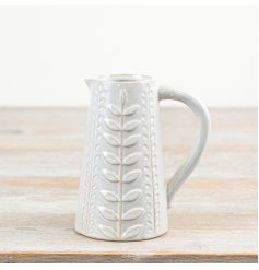 A stylish jug with a decorative leaf design pattern. Complete with a natural glaze.