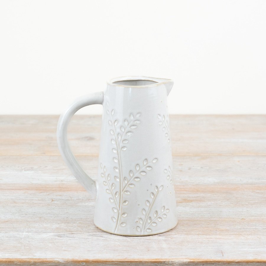 A stylish and elegant jug with a natural glaze. Complete with a chic leaf design. 