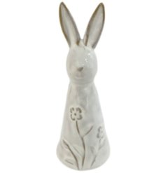A beautifully glazed rabbit ornament with a delicate cascading floral design. 