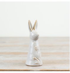 A charming rabbit ornament with a natural glossy glaze and pretty floral pattern. 