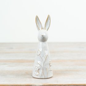 A pretty rabbit decoration with floral detailing and a natural glossy glaze.