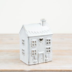 Stylish t-light holder with a cosy house design and glossy natural finish. Perfect for your home decor.