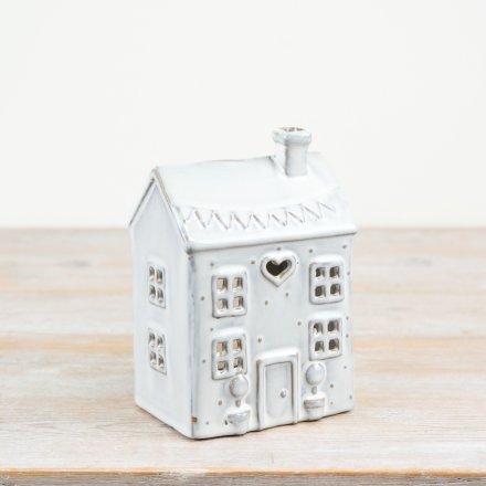 Bring warmth and style to any space with our glazed house-shaped t light holder. Perfect for creating a cosy atmosphere
