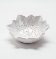 A chic flower shaped trinket dish with a natural, glossy glaze. 