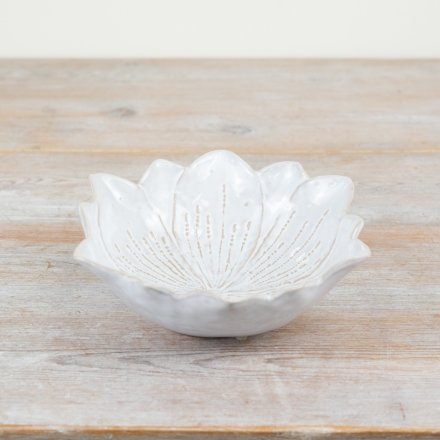 A chic flower shaped trinket dish with a natural, glossy glaze. 