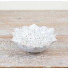 A chic flower shaped trinket dish with a natural, glossy glaze. 