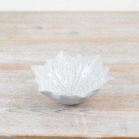 A chic flower shaped trinket dish with beautiful detailing and a glossy natural glaze. 