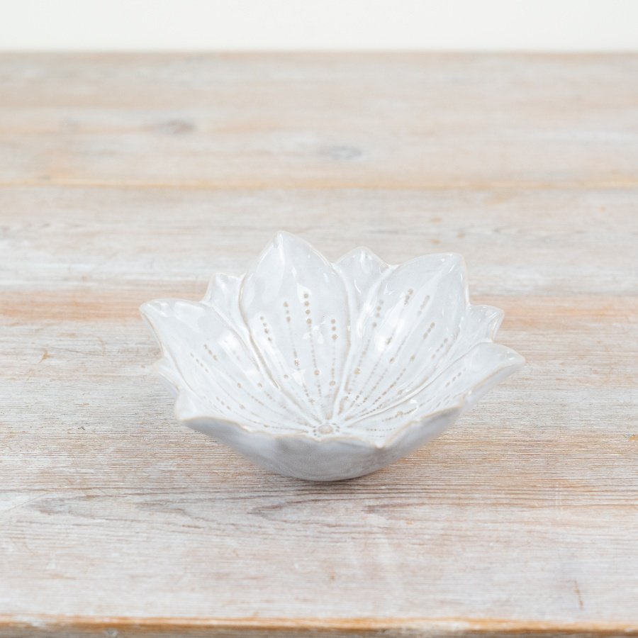 A chic flower shaped trinket dish with beautiful detailing and a glossy natural glaze. 