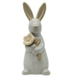 A charming rabbit ornament with flower. Beautifully detailed with glazed and unglazed elements.