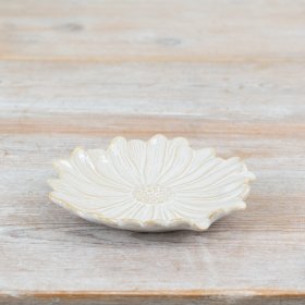 A beautifully crafted flower shaped dish with a handmade aesthetic. Glazed in natural tones with a glossy finish. 