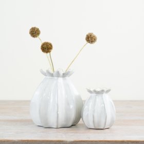 "Add elegance with our white bud vase, featuring a stunning design.