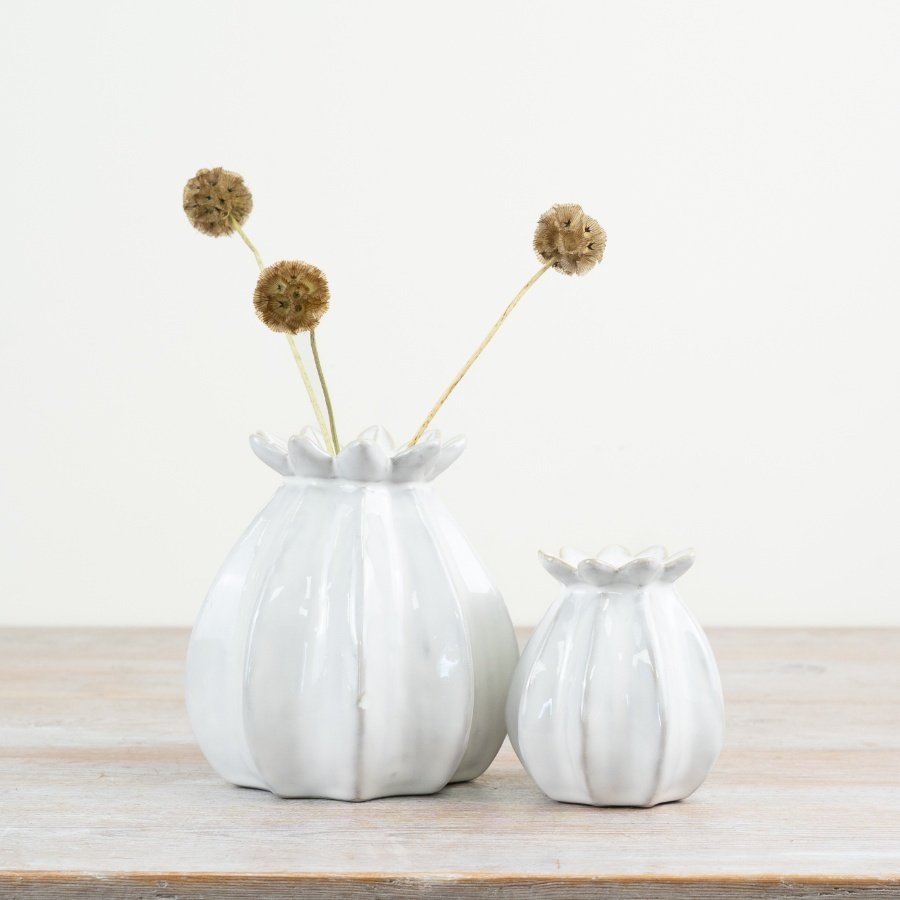 "Add elegance with our white bud vase, featuring a stunning design.