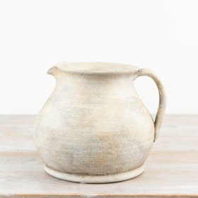 Charming terracotta vase with a warm, natural earthy hue.
